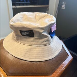Dutch Bros Tan Bucket Hat with Black Patch